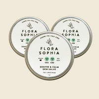 Three containers of Flora Sophia Soothe and Calm Skin Salve